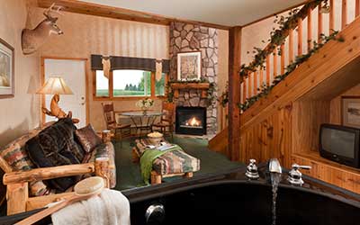 View of the living room in the Hunter's Den Suite